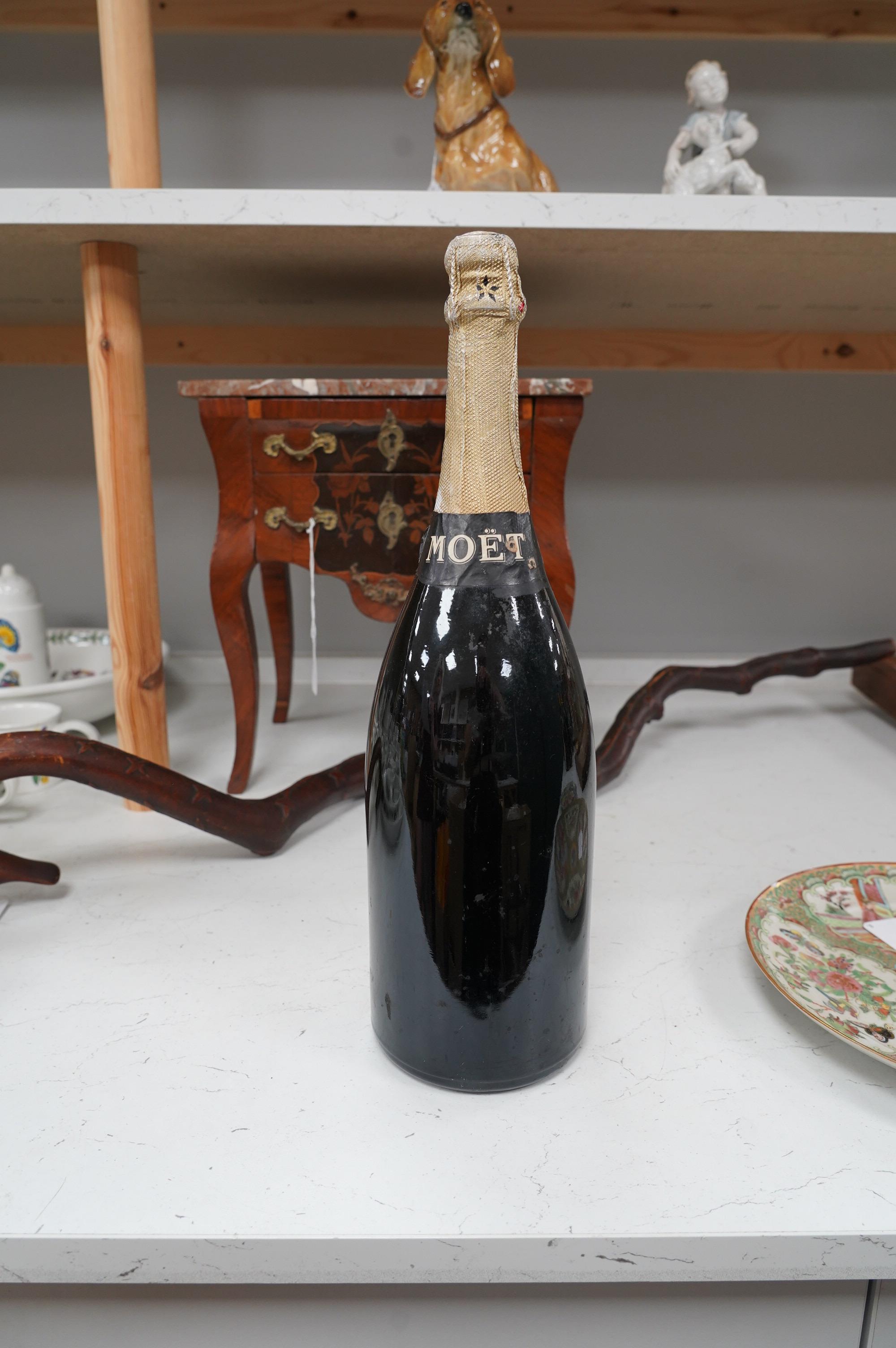 A Magnum of Moet & Chandon champagne. Condition - fair, some wear to label and foil